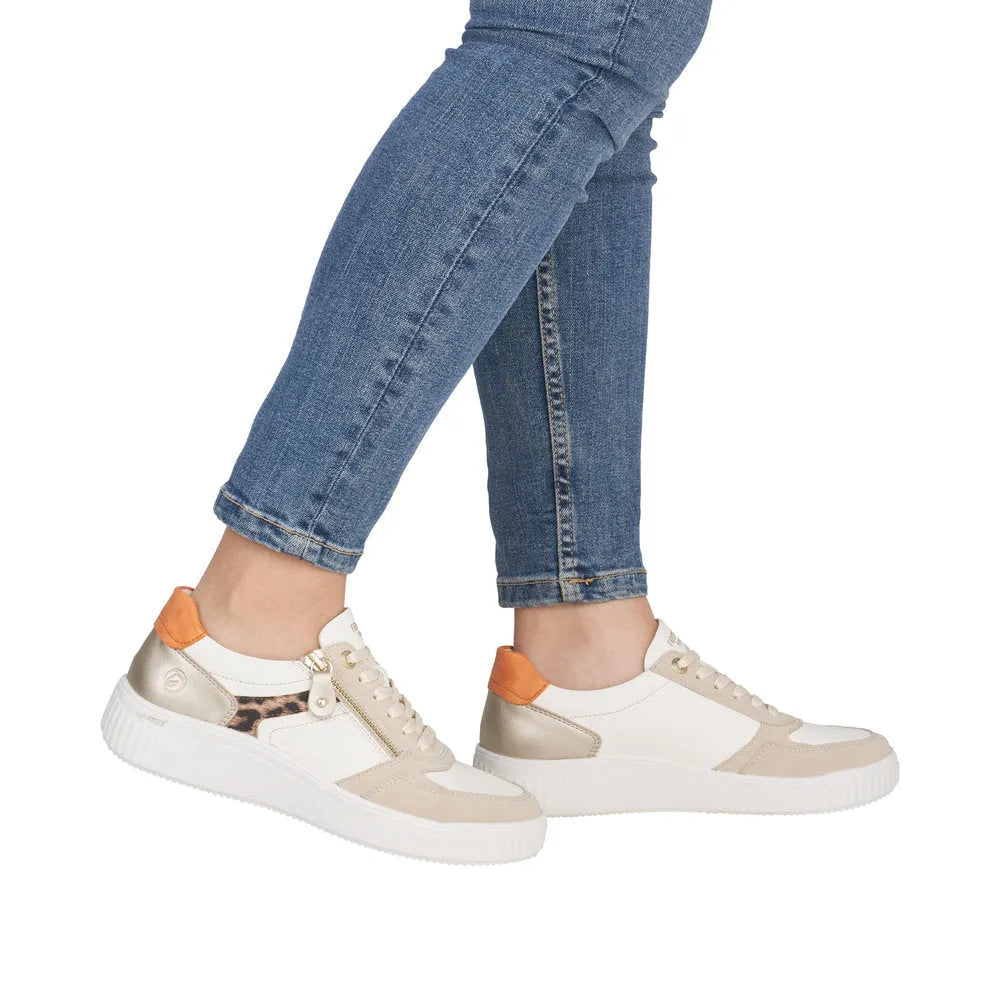 Ladies' wide zip and lace shoes in white, beige, and orange with leopard print accent; trendy athletic style.
