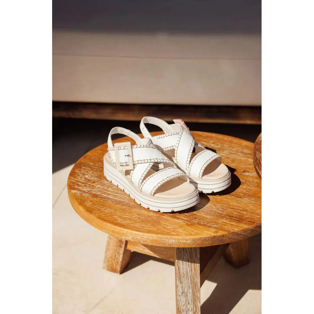 Remonte D3N51-80 women's off-white leather sandals with touch fastening and chunky sole on wooden stool.