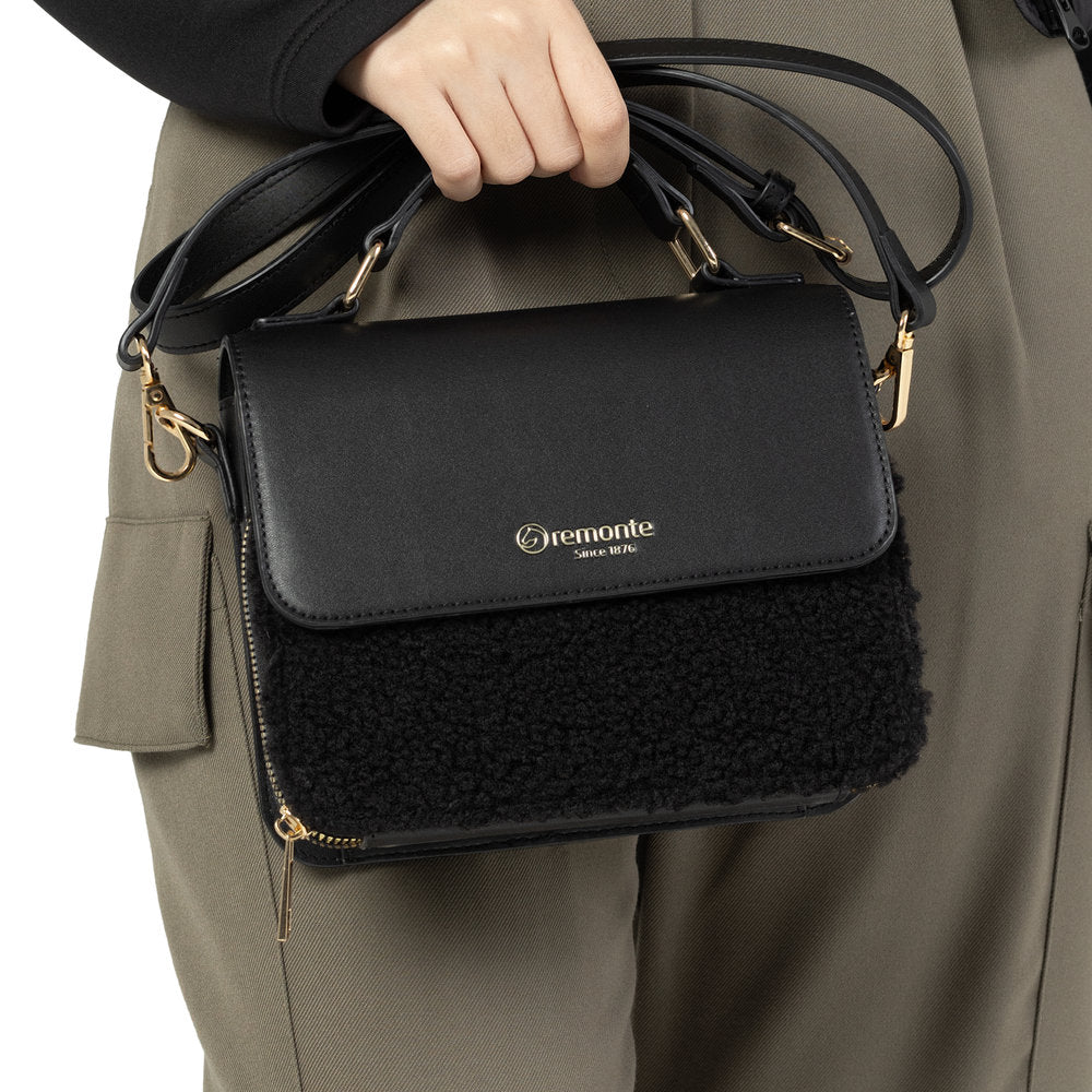Remonte Q0632-02 black handbag with zip and gold hardware, featuring a textured front panel and adjustable strap.