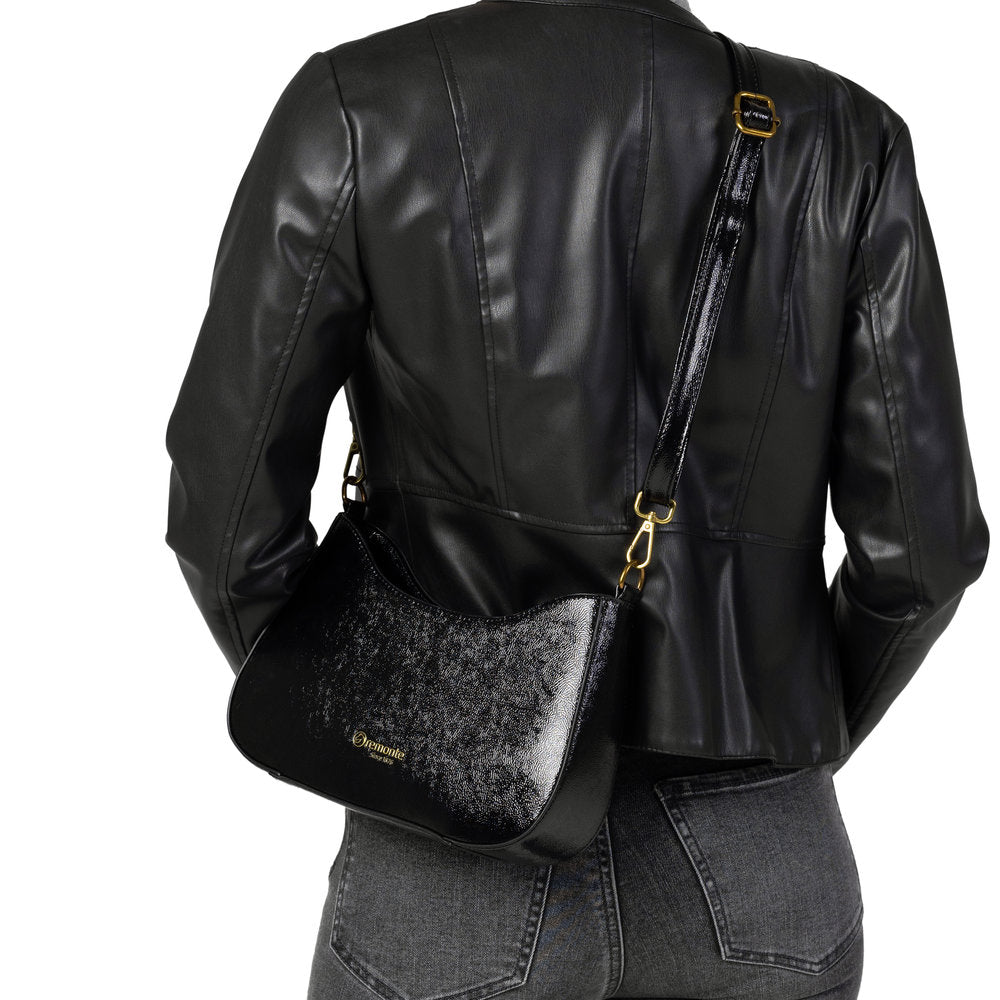 Remonte Q0721-02 women's black leather shoulder handbag with gold accents and adjustable strap on model.