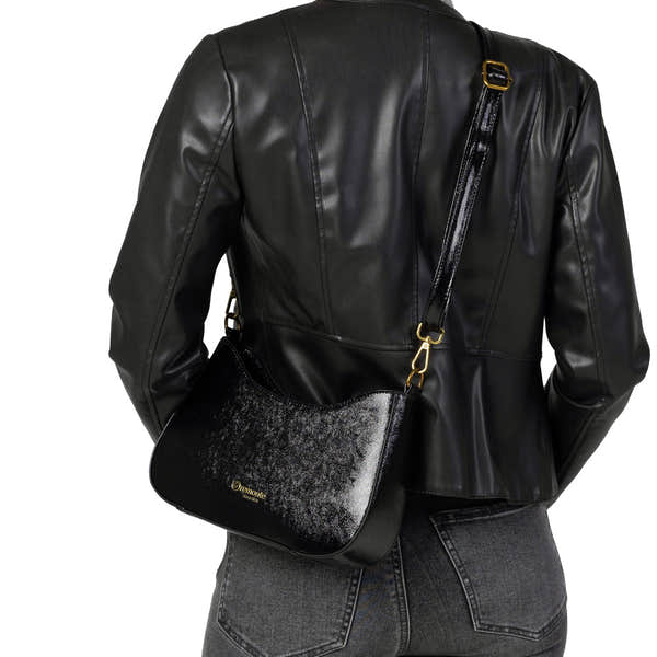 Remonte Q0721-02 women's black leather shoulder handbag with gold accents and adjustable strap on model.