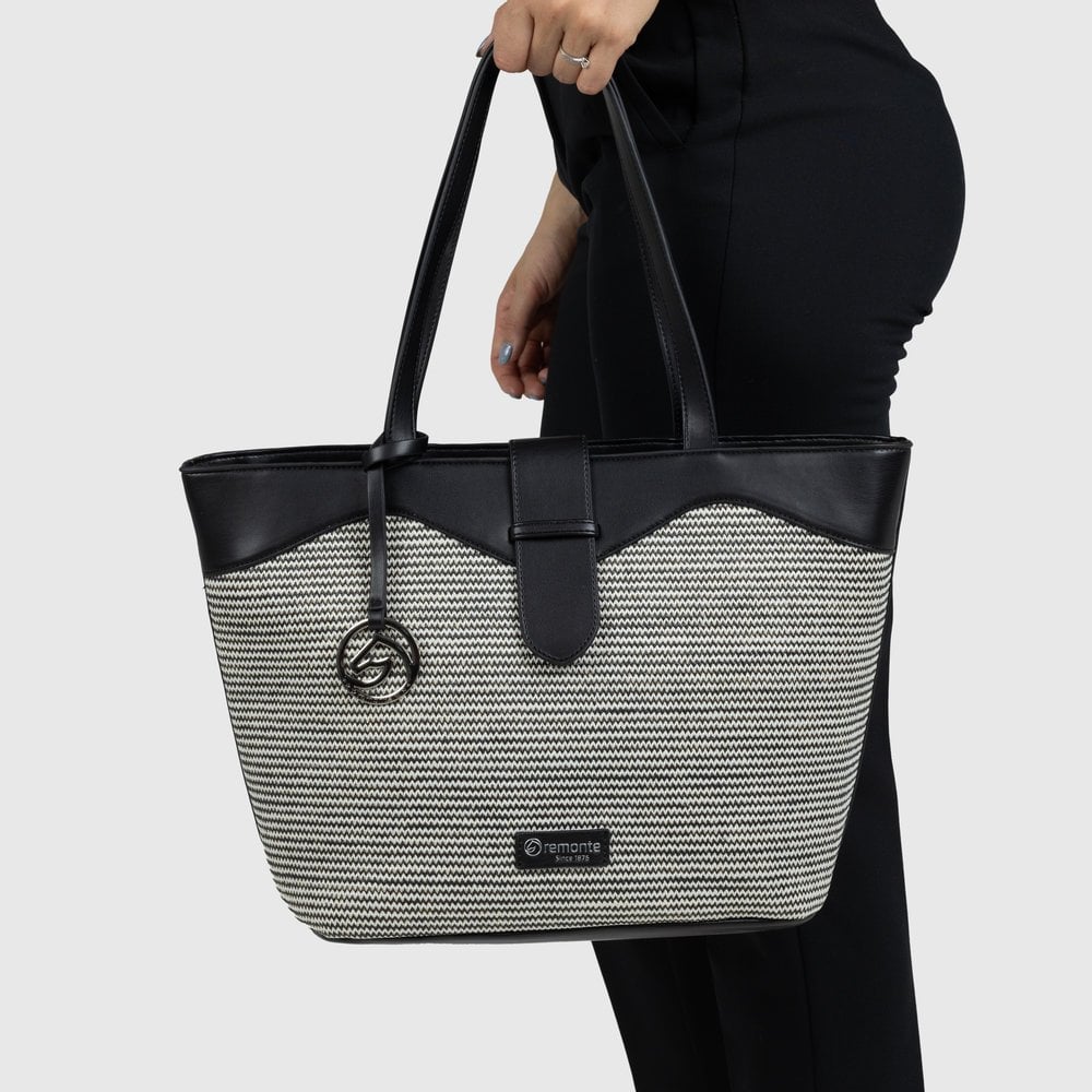 Remonte Q0759-02 Black & White Tote Bag with faux leather accents and logo charm, spacious for everyday use.