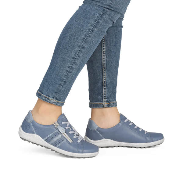 Remonte R1432-15 ladies wide blue leather shoes with zippers, laces, and white soles, worn with denim jeans.