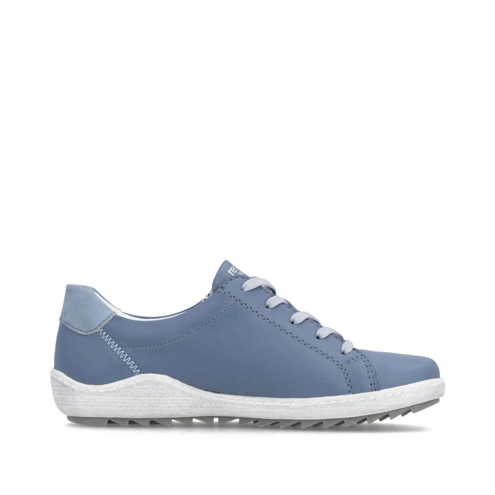 Blue leather women's sneaker with lace-up and zipper detail, white sole, and wide fit style.