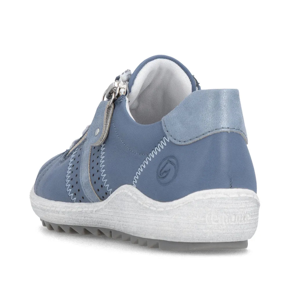 Blue leather women's sneaker with zip and lace, wide fit, white sole, and suede accents.