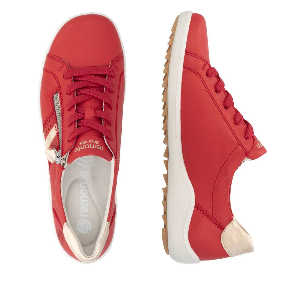 Red leather ladies' sneakers with zip and lace-up closure, white and beige accents, and a rugged gum sole.