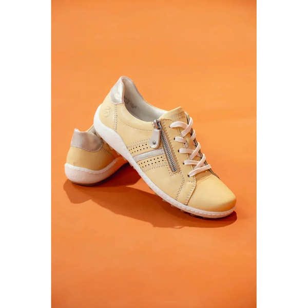 Remonte R1432-69 women's yellow leather casual shoes with zip, lace-up design, and white sole on orange background.