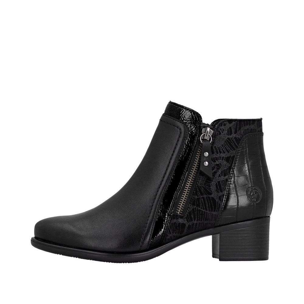 Remonte R5172-00 women's black ankle boots with side zip, block heel, faux leather and textured black design accents.