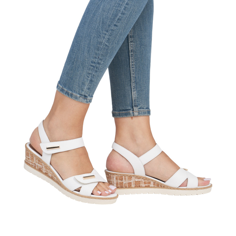 Remonte R6266-80 women's white leather wedge sandals with touch fastening straps and patterned cork heels.