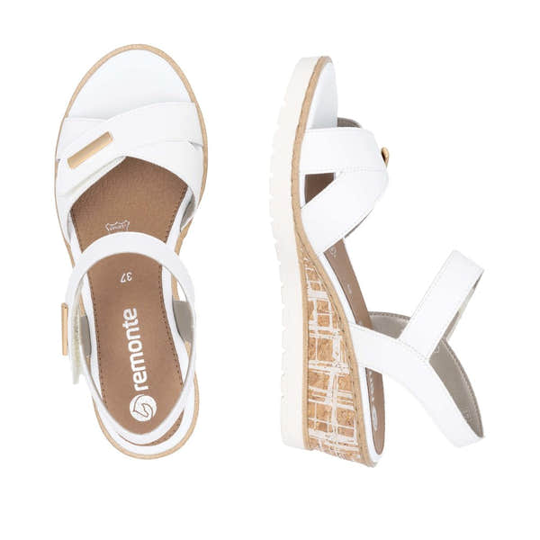 White leather touch-fastening sandals for women with cork wedge soles and adjustable straps.