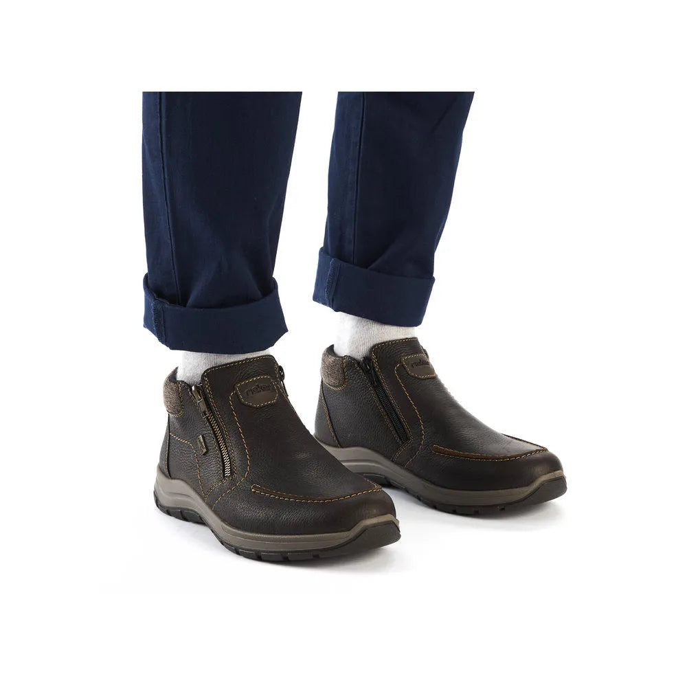 Rieker 03660-25 men's brown leather water-resistant twin zip ankle boots with rugged sole and stitching detail.