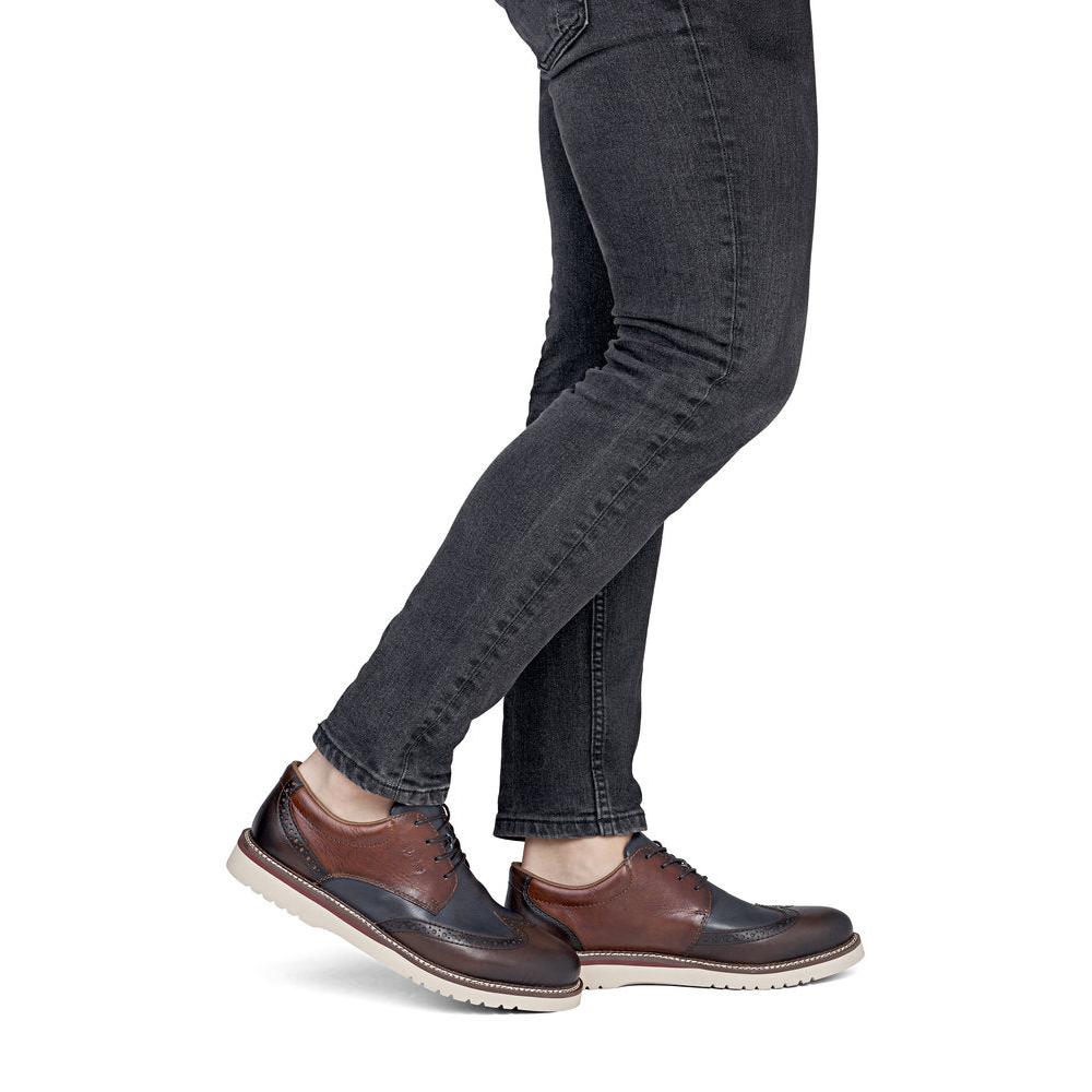 Rieker 04504-25 men's wide brown/navy leather lace up shoes, on-foot lifestyle view.