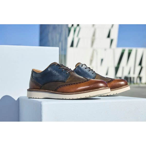 Rieker men's multi-color leather lace-up shoes with brown, blue, and tan panels, white sole, stylish casual footwear.