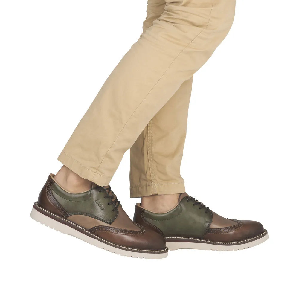 Men's Rieker 04504-91 wide-fit brown and green leather lace-up shoes with brogue detailing and white rubber soles.
