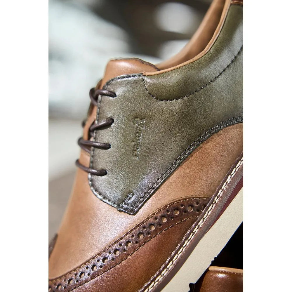 Brown and green leather lace-up shoes with brogue detailing, wide fit, and stitched accents.