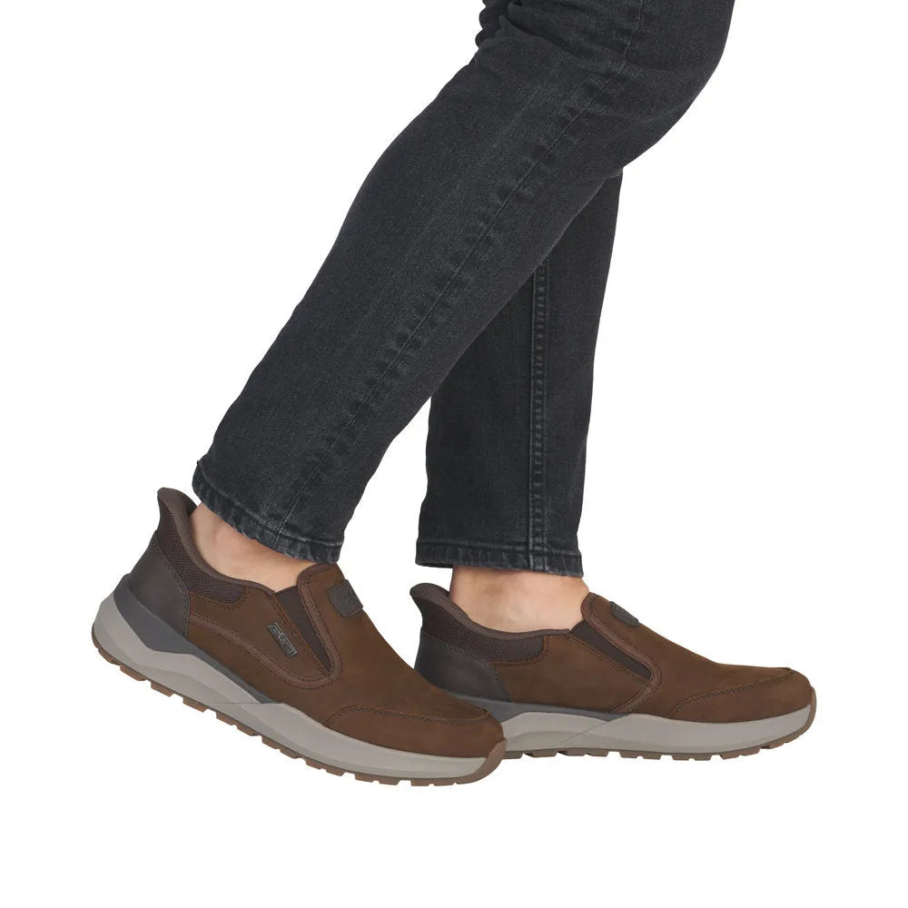 Rieker 06052-22 men's brown suede slip-on shoes with water resistance, athletic sole, casual design, and comfort fit.