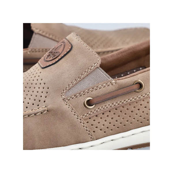 Rieker 08866-64 men's beige slip-on deck shoes with perforated detail, brown accents, and white sole.