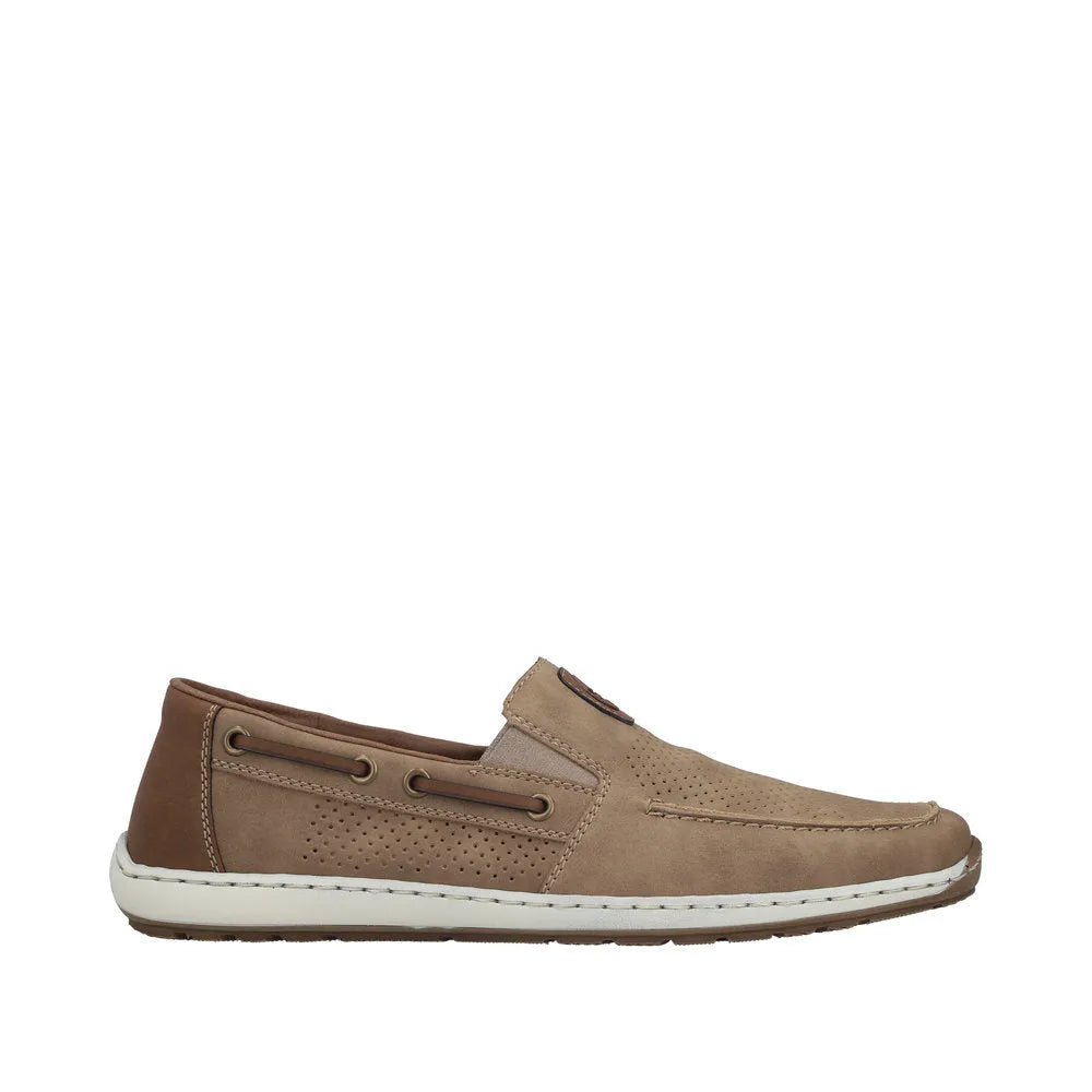 Beige slip-on deck shoe with perforated detailing, lace-up sides, and white rubber sole, styled for casual summer wear.