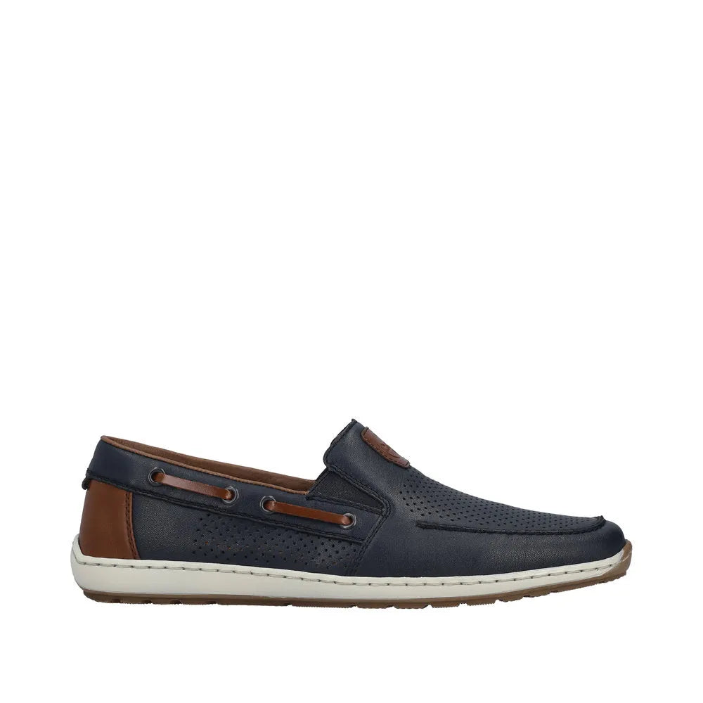 Men's wide Pacific blue leather slip-on shoe with elasticated sides, brown accents, perforated detailing, and a white rubber sole.