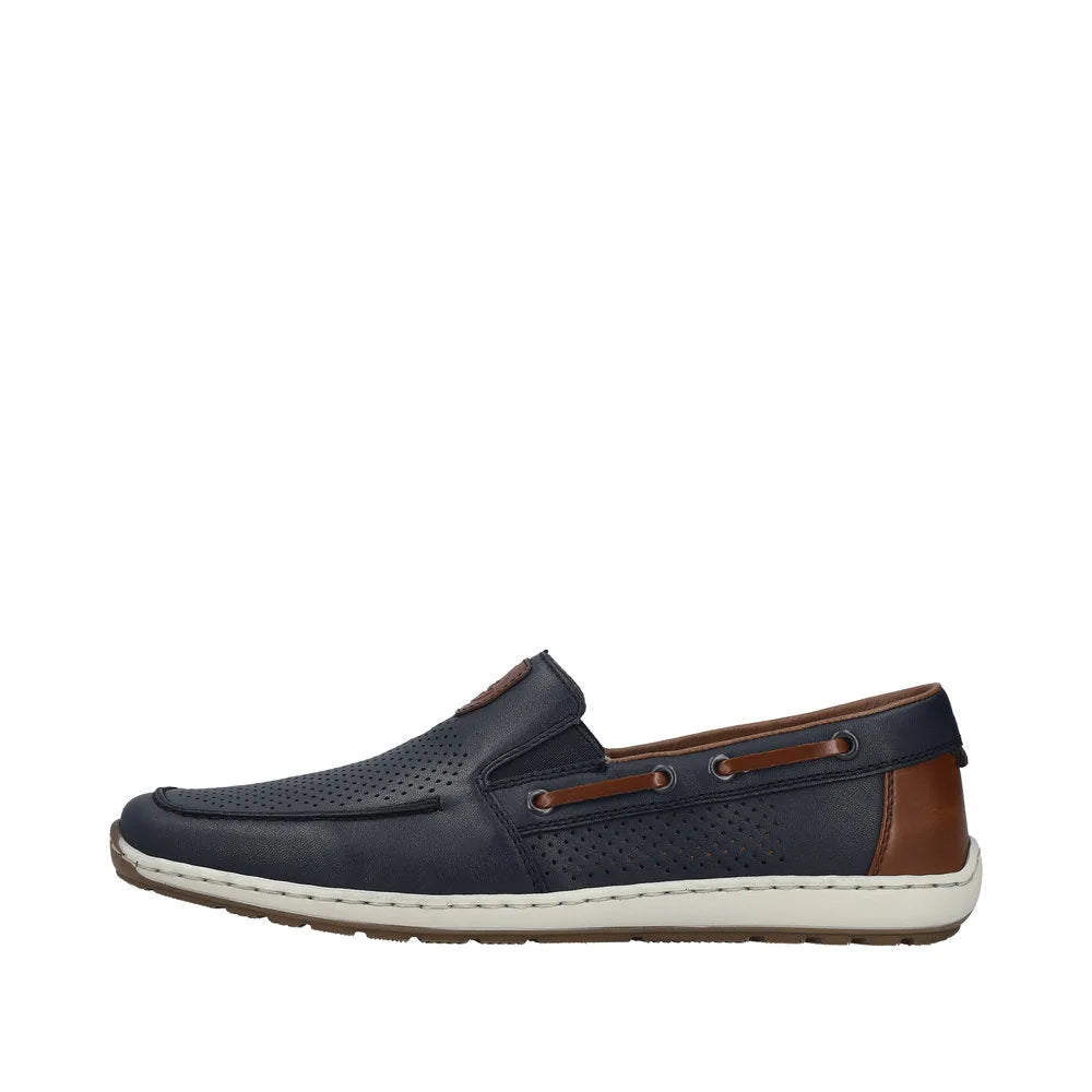 Rieker 08867-14 men's wide navy blue leather slip-on shoes with brown accents and elastic side panels.