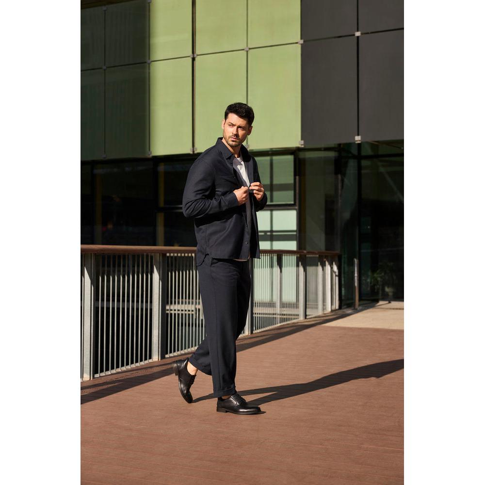 Rieker 10353-00 men's wide black leather slip-on shoes, stylish and comfortable for formal or casual wear.