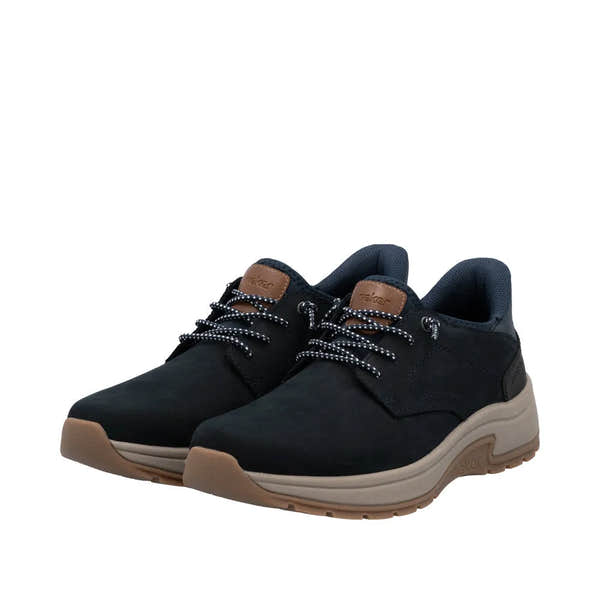 Rieker 11050-14 men's wide fit blue suede slip-on shoes with black and white laces, cushioned collar, and beige rubber sole.