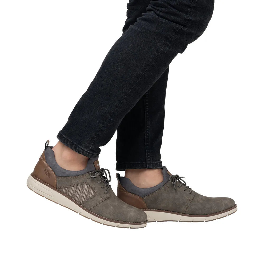 Men's brown elasticated lace-up shoes with suede and leather accents, grey ankle lining, and white rubber sole.