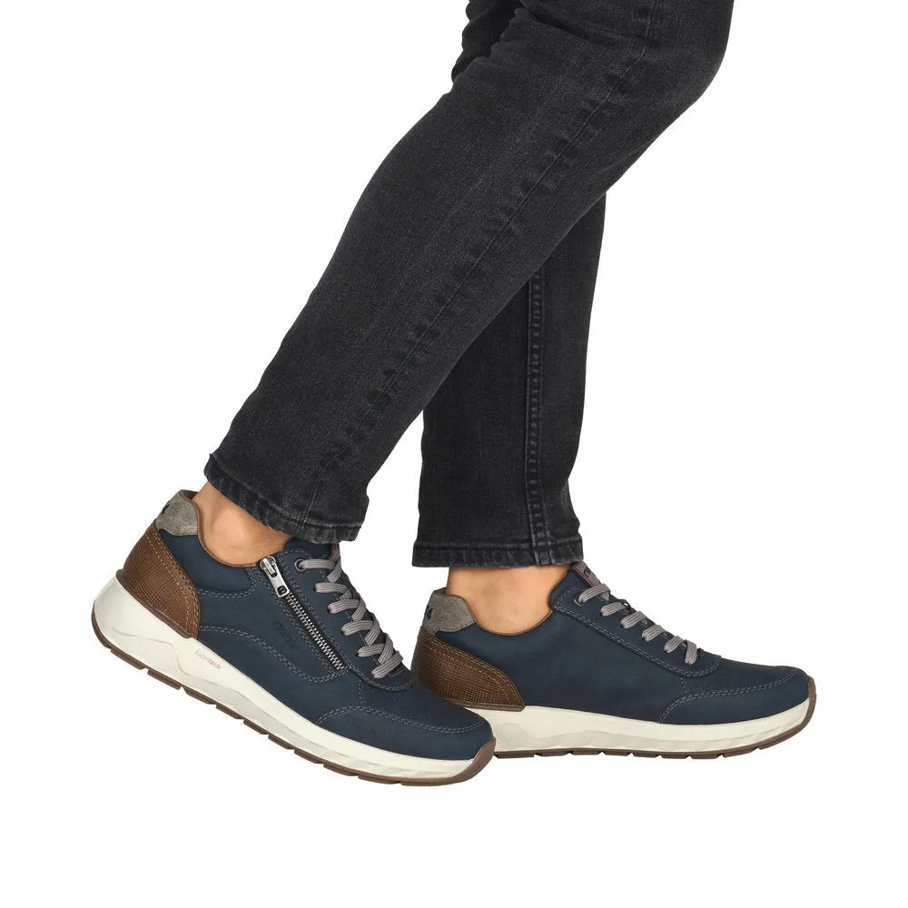 Rieker 11504-14 men's wide navy shoes with zip and lace-up closure, brown heel accents, gray laces, and cushioned white sole.