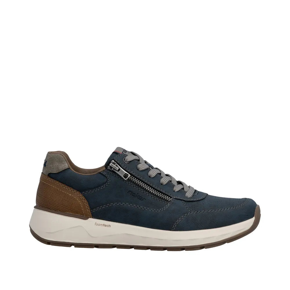 Men's navy blue leather-style sneakers with zip and lace fastening, grey laces, brown heel accent, and white foam technology sole.