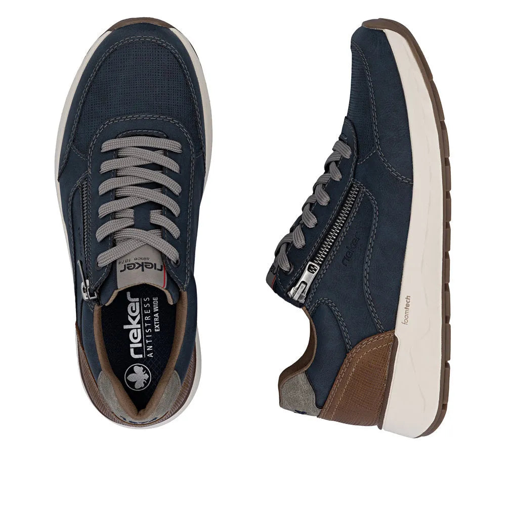 Men's navy blue leather and textile sneakers with grey laces, side zipper, brown accents, and white sole.