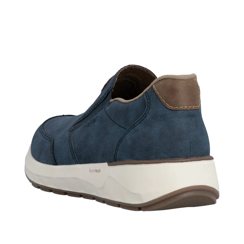 Rieker 11550-15 men's slip-on shoes in blue denim with beige accents, suede upper, cushioned sole, and breathable design.