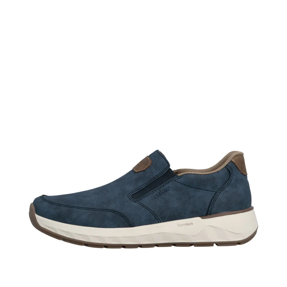 Men's wide denim blue slip-on shoes with suede accents, cushioned white sole, and breathable interior.