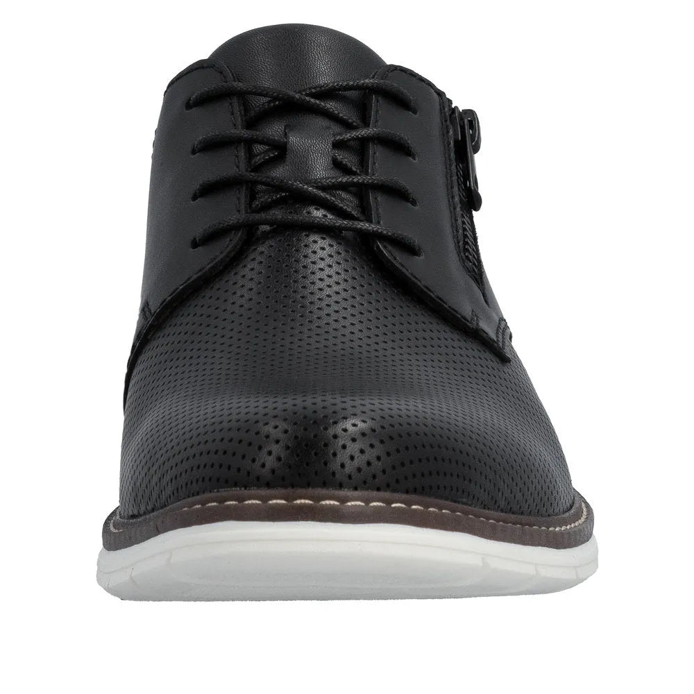 Black leather men's dress shoe with perforated toe, lace-up front, and side zipper, on a white sole.