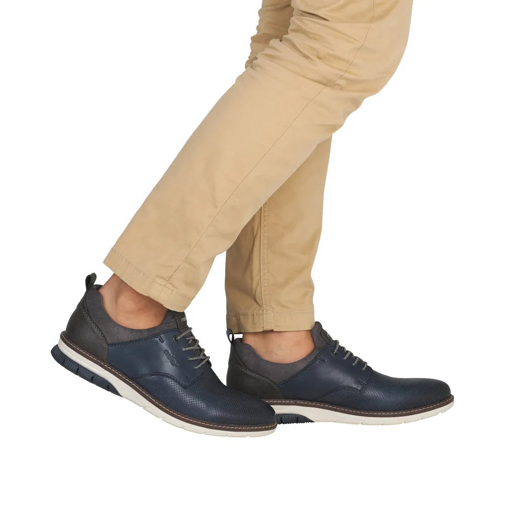 Men's navy leather elasticated shoes with black accents and white soles, stylish and comfortable.