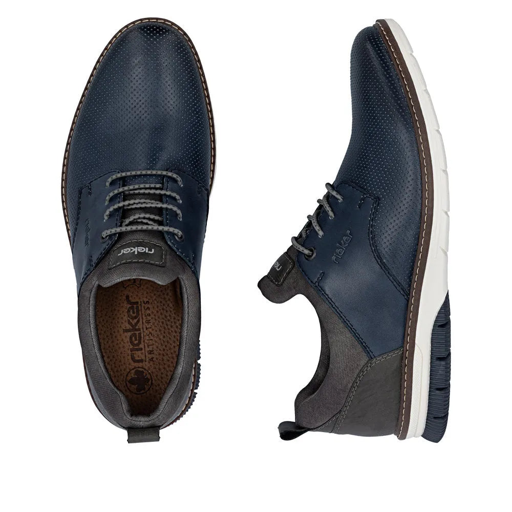 Rieker 14450-16 men's navy leather elasticated shoes with perforated texture, white sole, and padded collar.