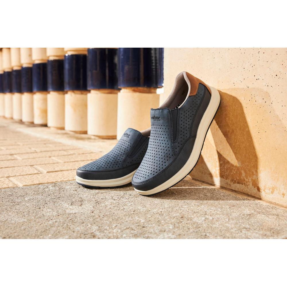 Rieker men's navy slip-on shoes with perforated design, wide fit, cushioned sole, and brown accents, style 16952-14.