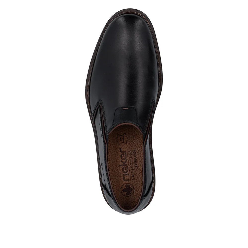 Black leather men's wide slip-on shoe with elastic side panels and brown cushioned insole, model 17664-00.