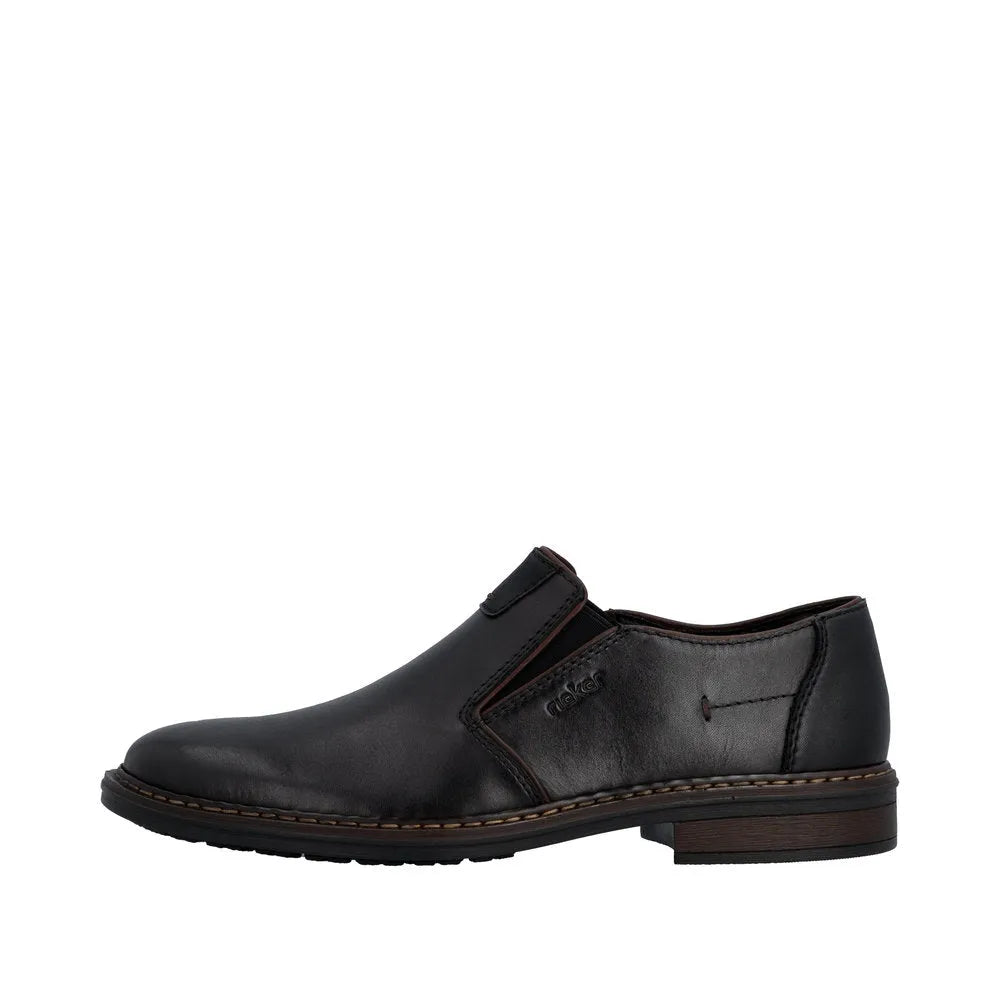 Black leather men's wide fit slip-on shoes with elastic side panels and a low wooden heel.