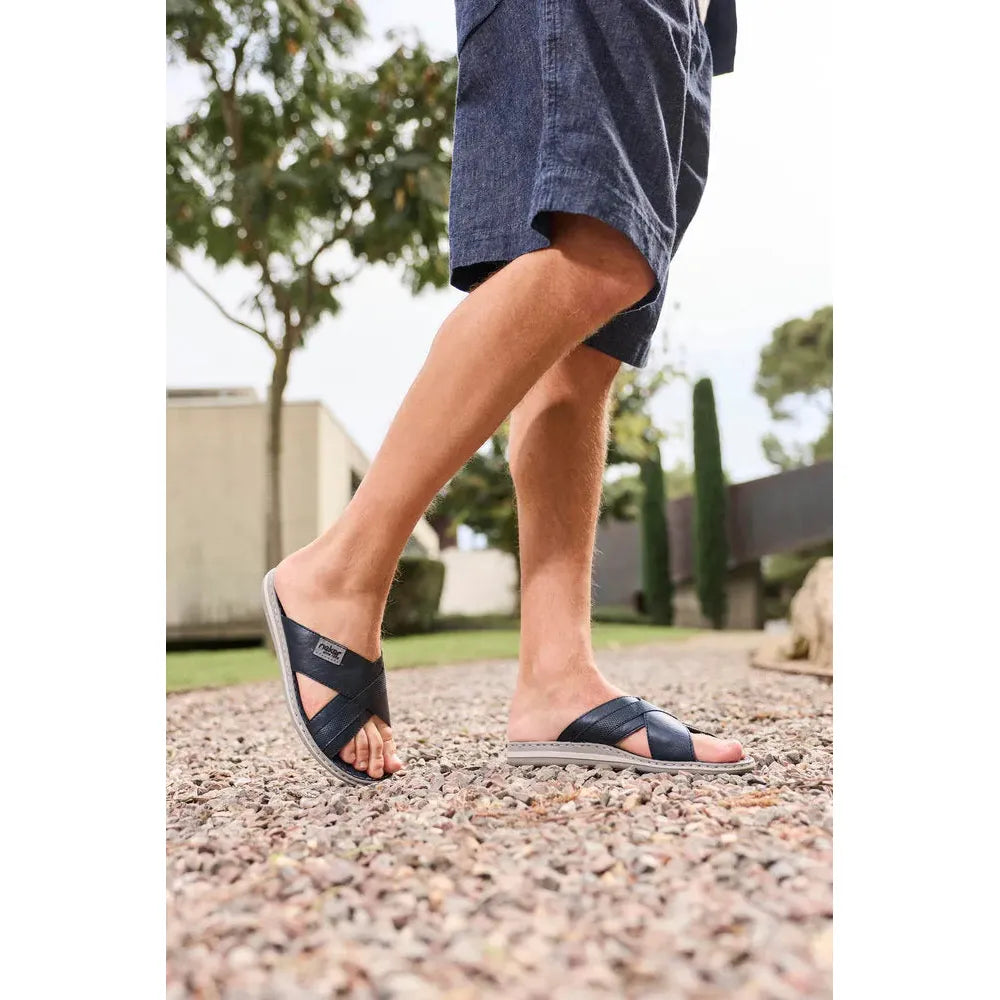 Rieker 21082-14 men's wide navy/grey leather elasticated mules, casual slip-on sandals, outdoor setting.