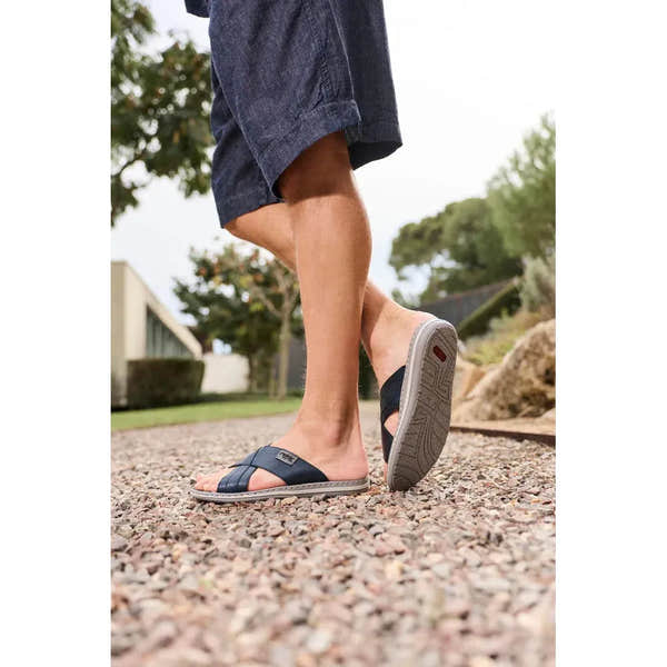 Rieker 21082-14 men's navy/grey leather elasticated mule sandals, open-toe slide with cushioned sole, outdoor setting.