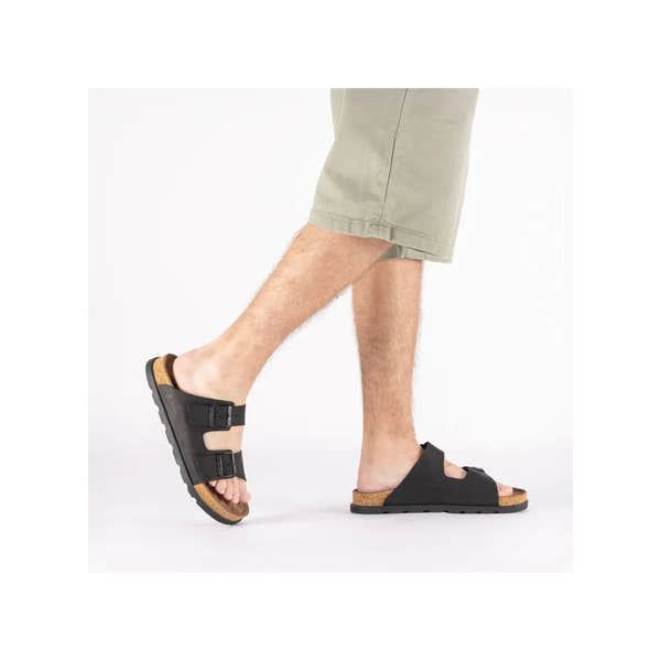 Rieker 21190-00 men's wide fit black suede buckle mule sandals with cork footbed and rubber sole.