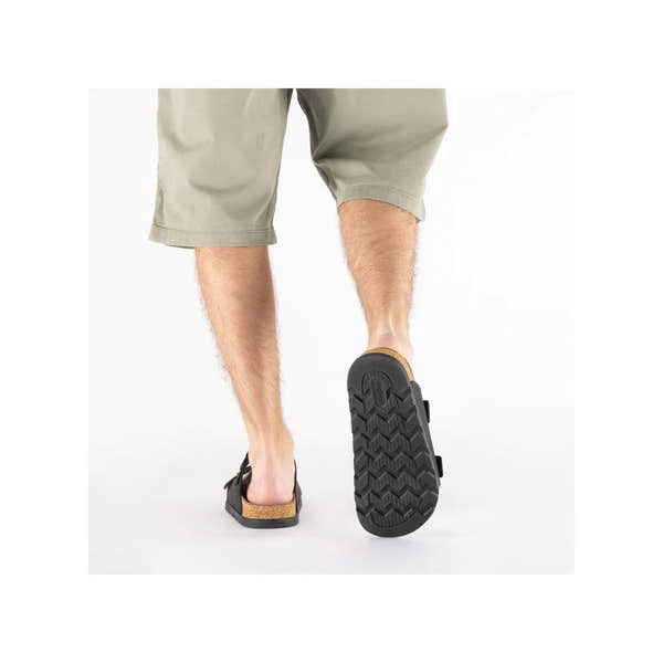 Rieker 21190-00 men's black suede wide-fit buckle mule sandals with textured rubber sole.