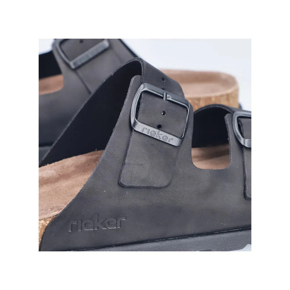 Rieker 21190-00 men's black wide-fit suede buckle mule slides with adjustable strap and embossed logo.