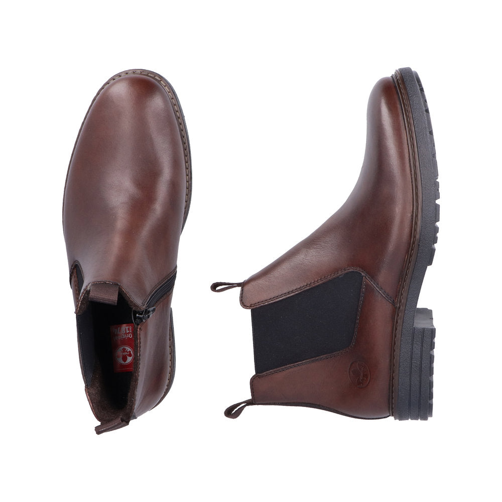 Rieker 33180-26 men's brown leather ankle boots with side zippers and rugged black rubber soles.