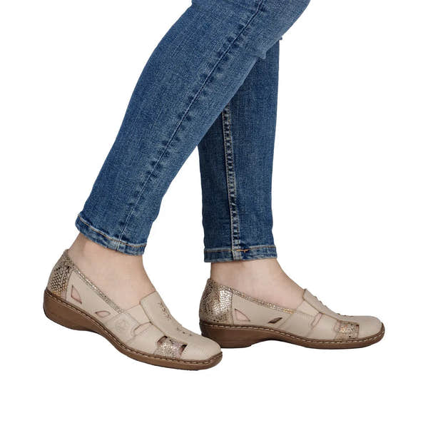Rieker 41385-63 beige leather elasticated flat shoes with glitter accents on heel and toe, worn with blue jeans.