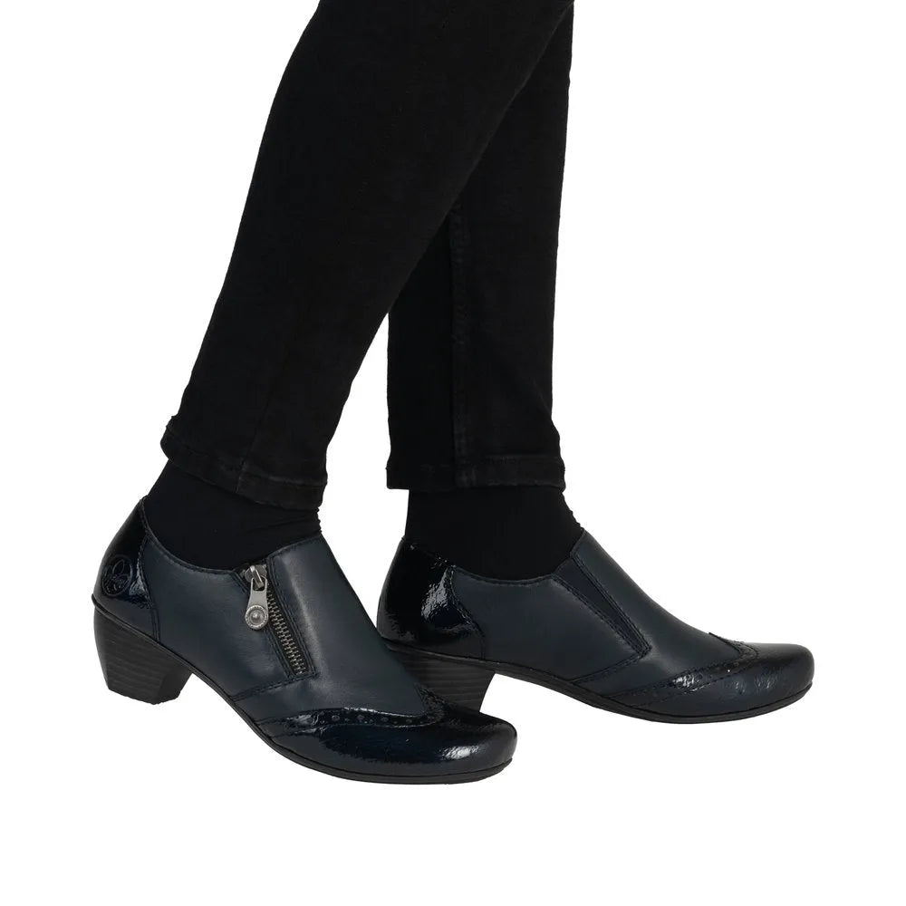 Rieker 41757-15 women's blue leather side zip ankle boots with block heel and decorative zipper detail.