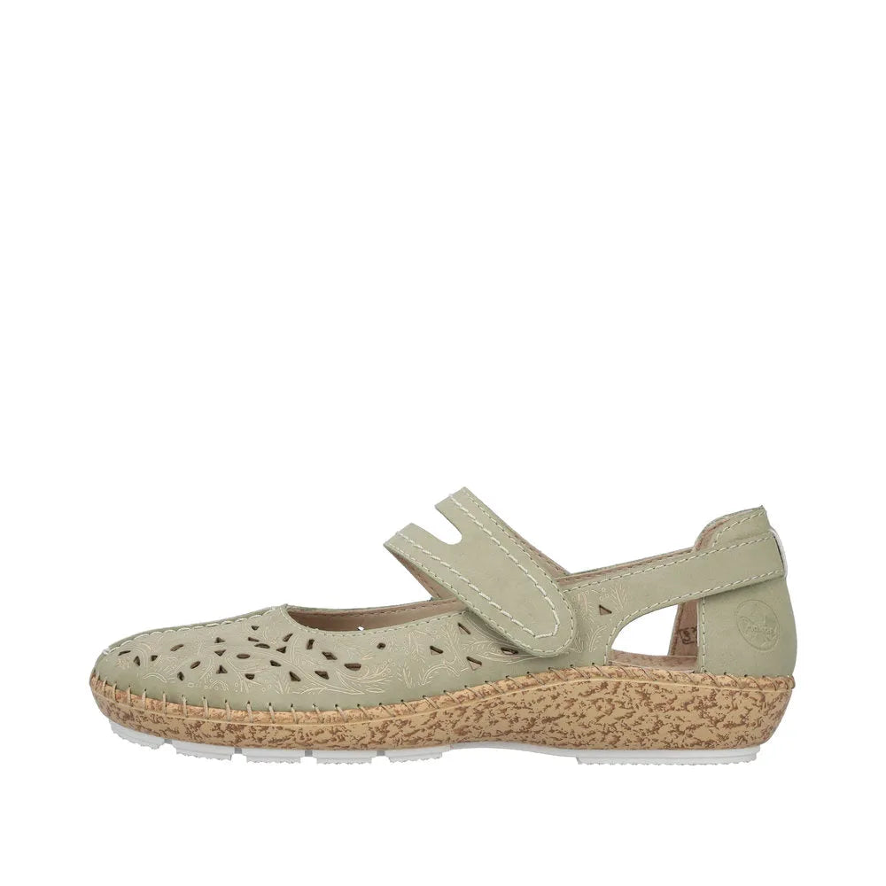 Green leather slip-on shoe with perforated floral design, touch fastening strap, and textured tan rubber sole.