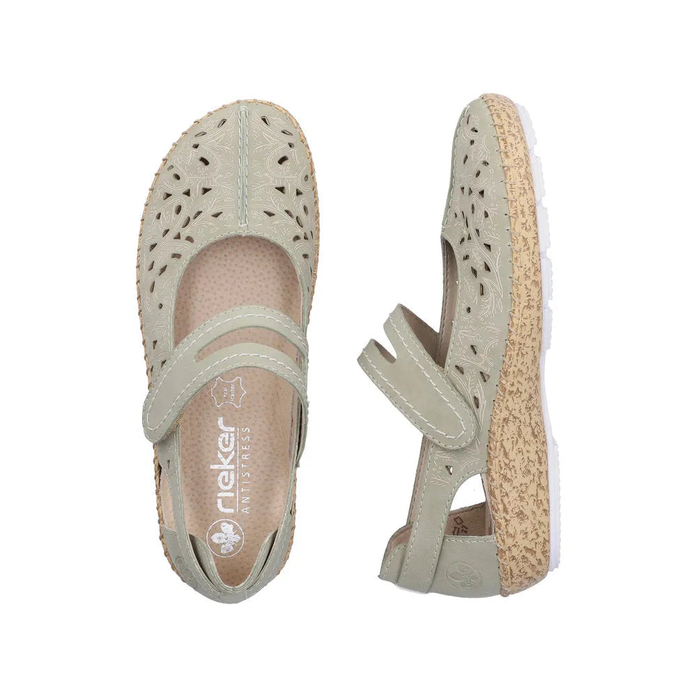 Green leather touch fastening shoes with intricate cut-out floral design and textured beige sole.