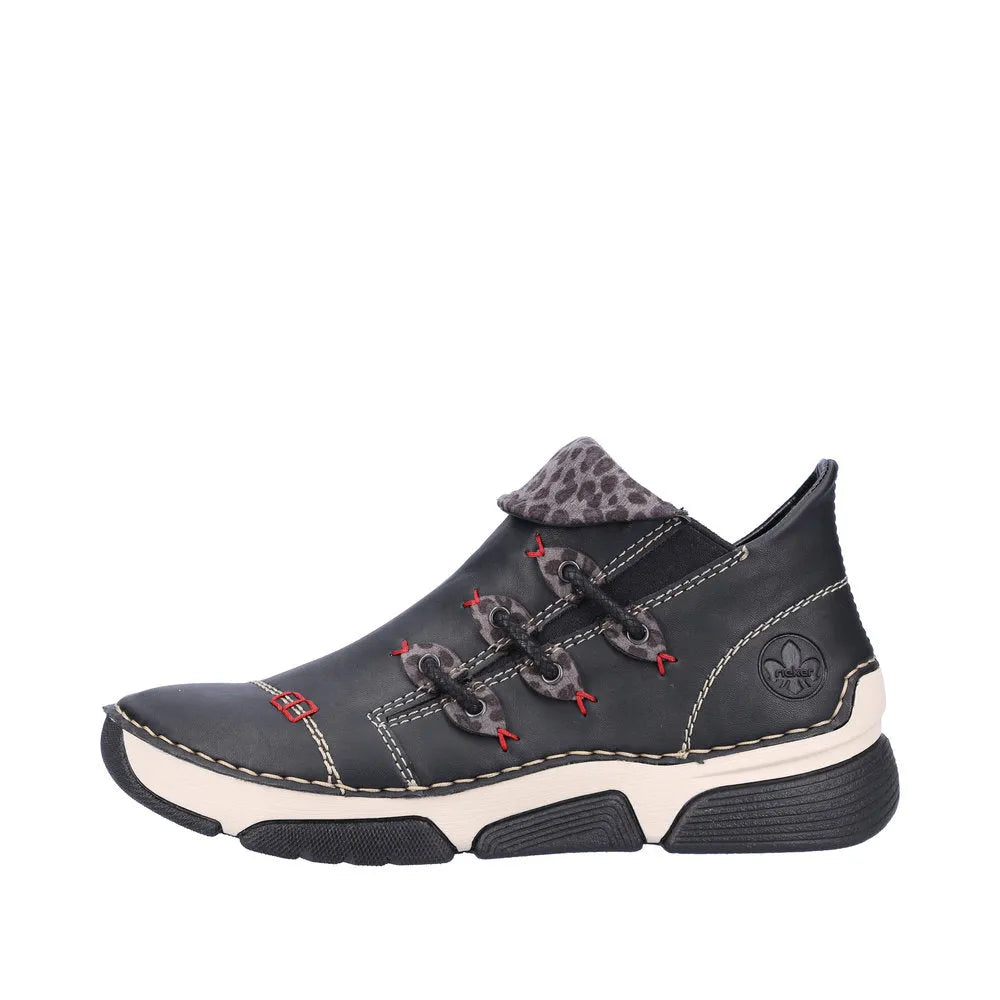 Rieker 45983-00 women's black ankle boot with side zipper, bold stitching, and leopard print detail on the tongue.