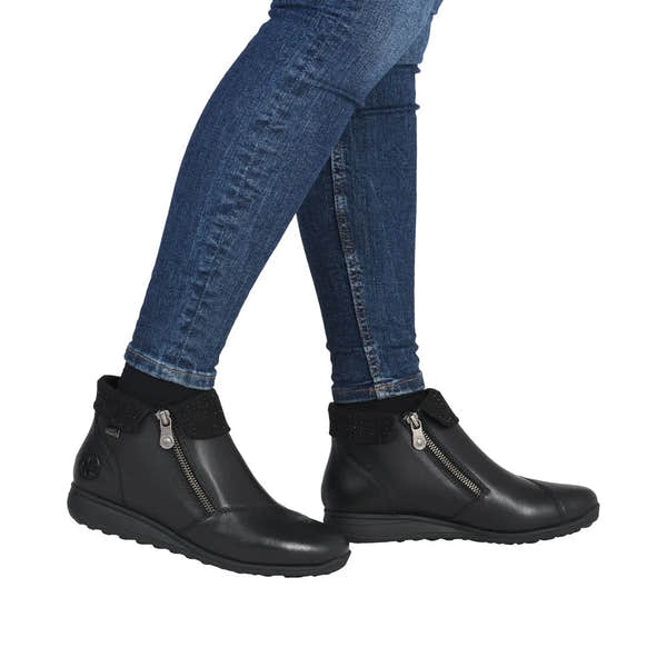 Rieker 47252-00 women's black leather water-resistant ankle boots with twin zips and textured ankle strap, casual and stylish footwear.